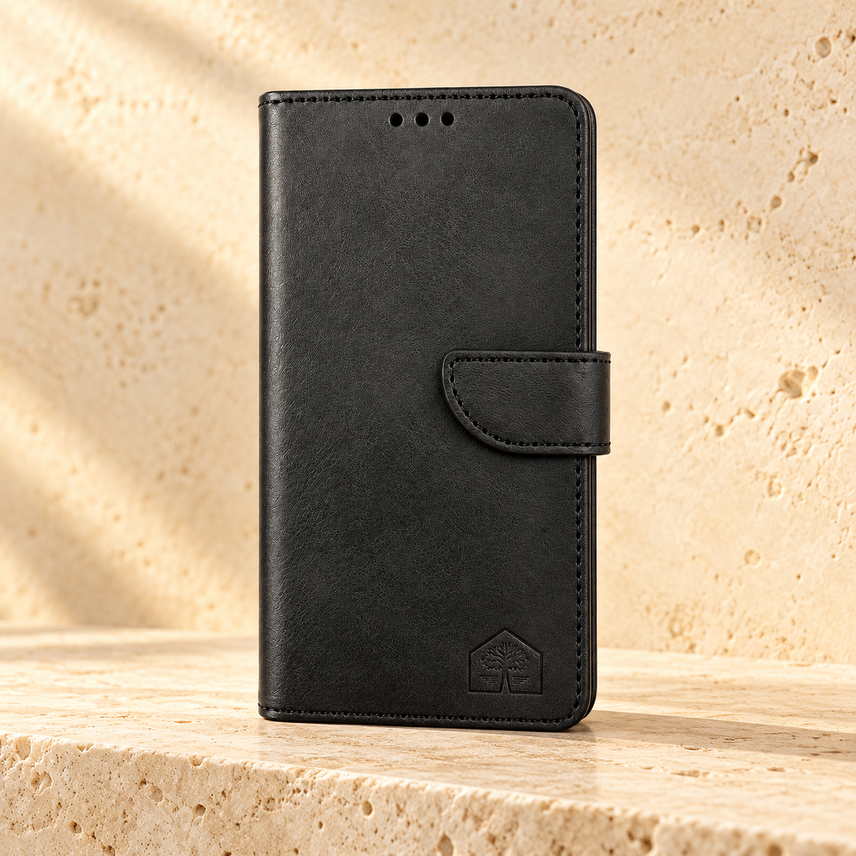 Black wallet phone case, closed front view, travertine